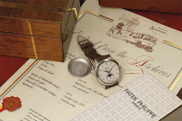 An exceptional, rare, and well‐preserved white gold perpetual calendar wristwatch with moon phase indication, and rare reversed date dial, original literature, and presentation box.